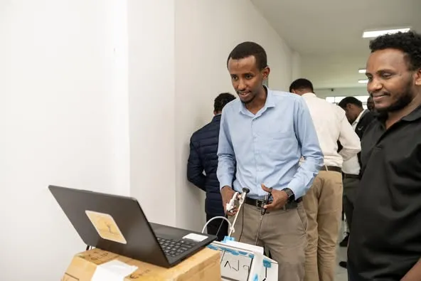Trainees at a laparoscopic simulation station